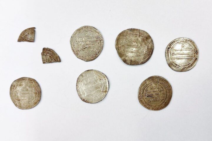 Six 9th-century Arab silver dirhams and two coin fragments found near Truso in northern Poland