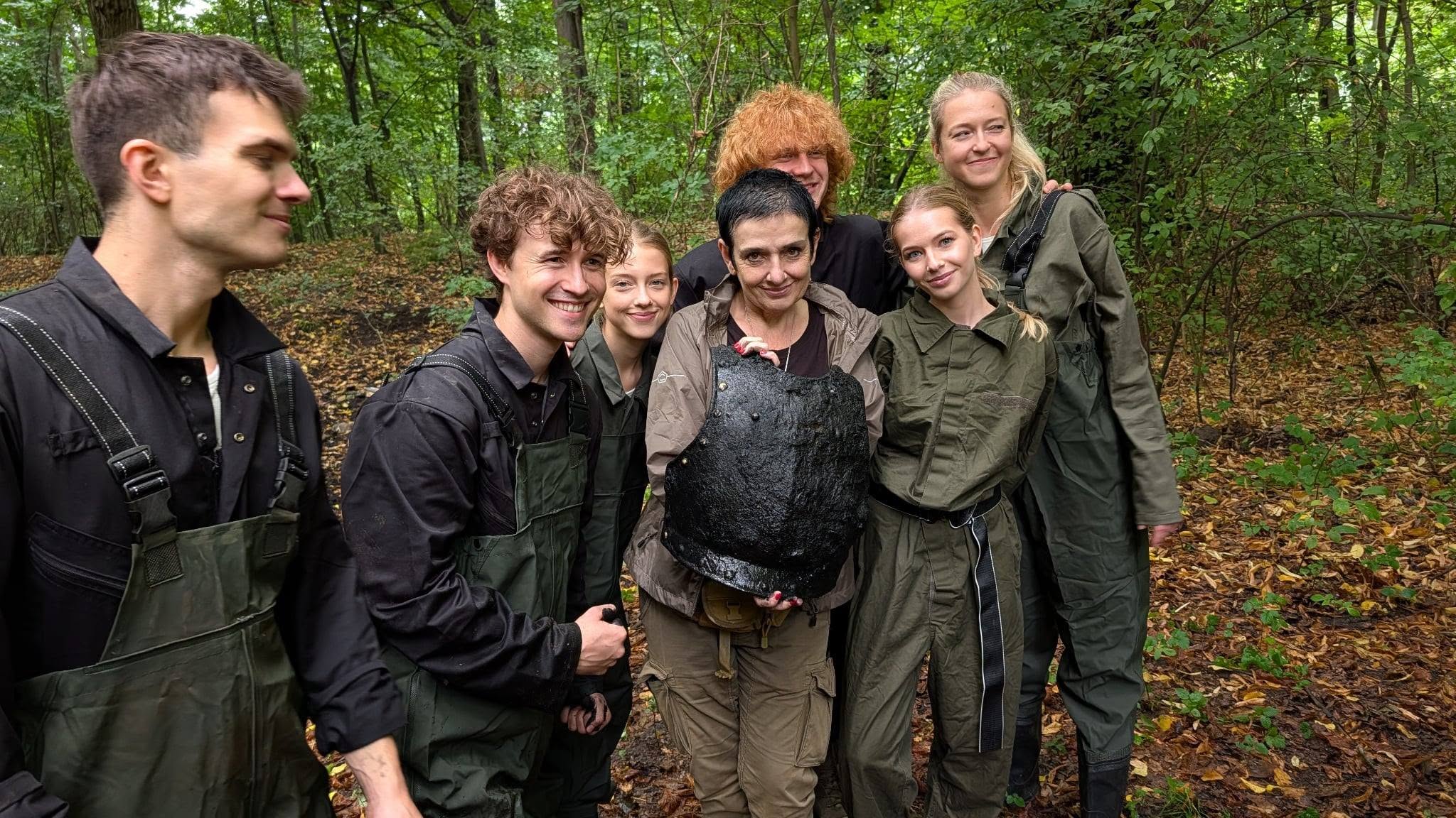 Members of the Pielaszkowice search team pose with the 19th-century German guard cuirass recovered from the palace moat in Lower Silesia. Credit: Muzeum Domu Śląskiego w Ziębicach