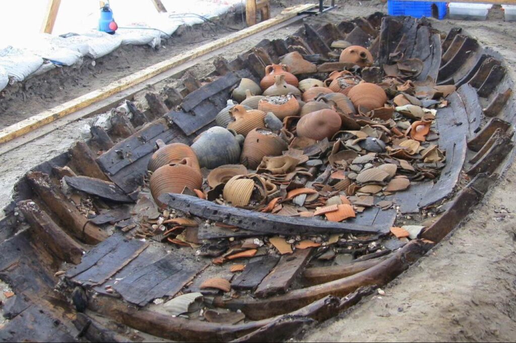 Amphora-type vessels recovered from a shipwreck discovered during the Yenikapı metro excavations in Istanbul, with many examples preserved in good condition despite some fragmentation.