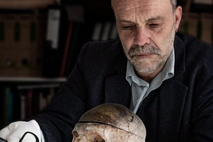 Grantown Museum curator Dan Cottam holding the mysterious Highland skull associated with a centuries-old Scottish clan legend.