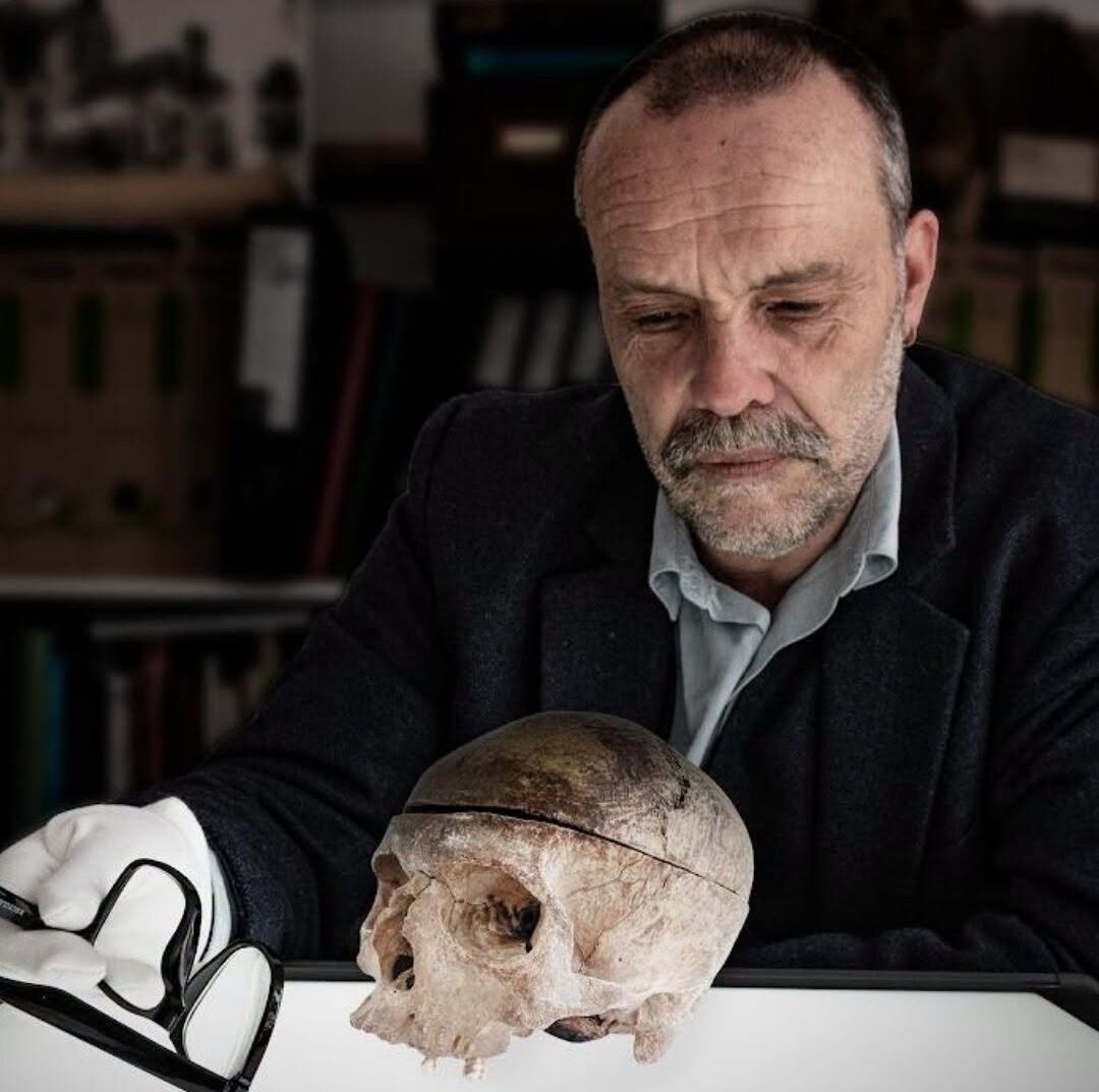 Grantown Museum curator Dan Cottam holding the mysterious Highland skull associated with a centuries-old Scottish clan legend.