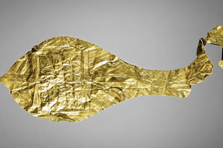 Ancient gold votive plaque bearing a Greek inscription dedicated to Jupiter Dolichenus, discovered at the Roman fortress of Apsaros in Georgia.