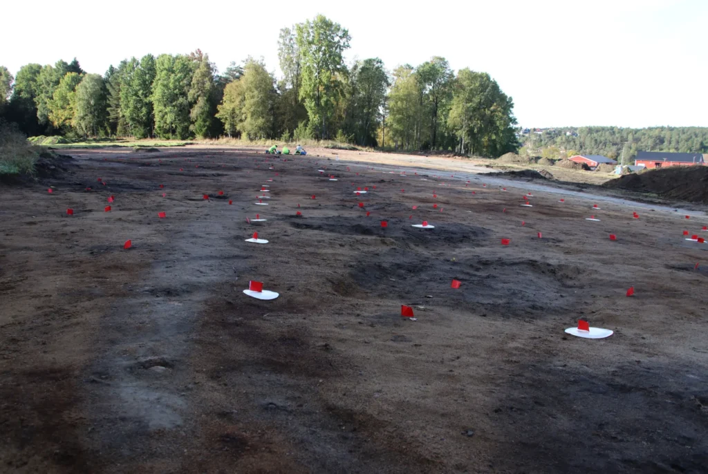Postholes and the wall trench marking the outline of the large prehistoric house at Hunn in Norway.