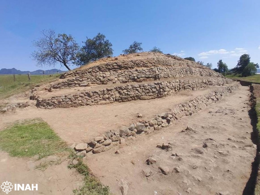 Stepped ancient stone structure with exposed limestone walls at Teteles de Ávila Castillo in Puebla, Mexico.