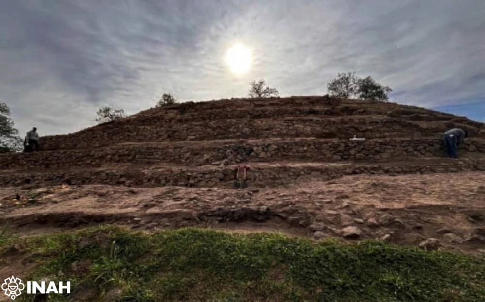 Sun shining above the stepped stone structure at Teteles de Ávila Castillo, an archaeological site associated with an ancient solar observatory in Mexico.
