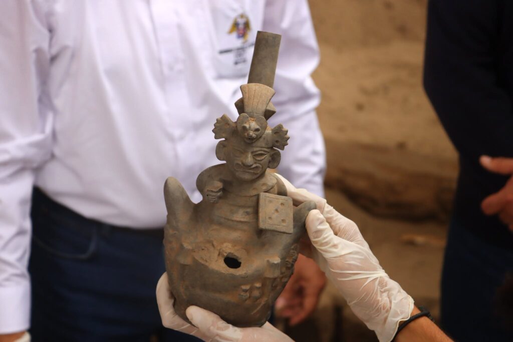 Ancient Moche ceramic figure representing a bird-like deity, found among 32 funerary offerings in Peru.